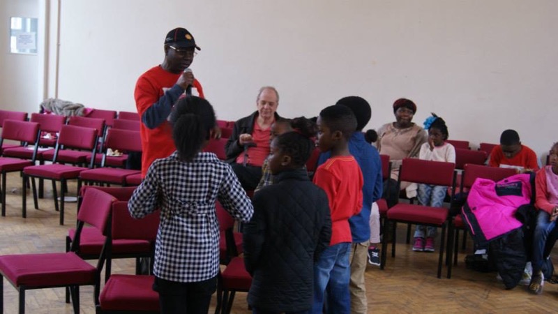 Church members talking together in the hall after a service